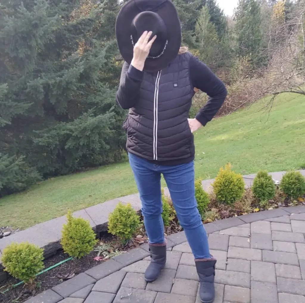 person in yard wearing Hilipert Heated Vest